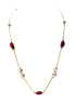 Long gold chain necklace with red pentagon shapes