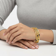 Gemini said Gold-Tone Stackable Bangles with Navy Accents – 2.4