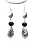 Three different beads dangle from fish hook earrings. Antique silver finish engraved pear shape beads on the bottom connected to glassy black beads, which silver faceted flat bead on top of it. Matching necklace is available both in long charm and short w