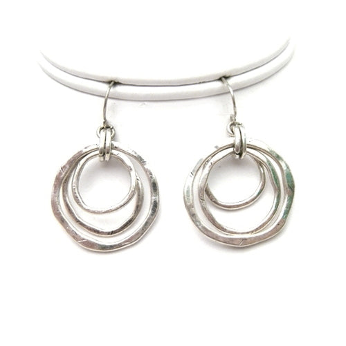 Try our geometric circle earrings. Three different size silver circles dangle from fish hook earrings, and create urban and intelligent look. Wear this metal earrings with matching necklace which is available in two different options.